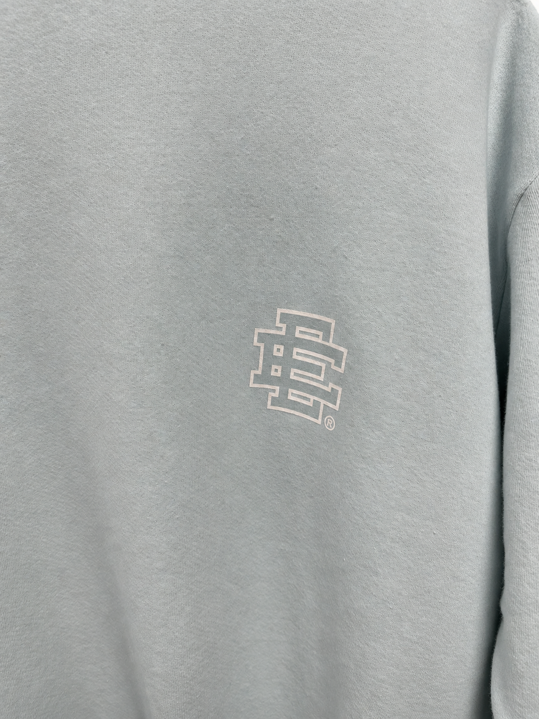 Chest logo detail studio view.