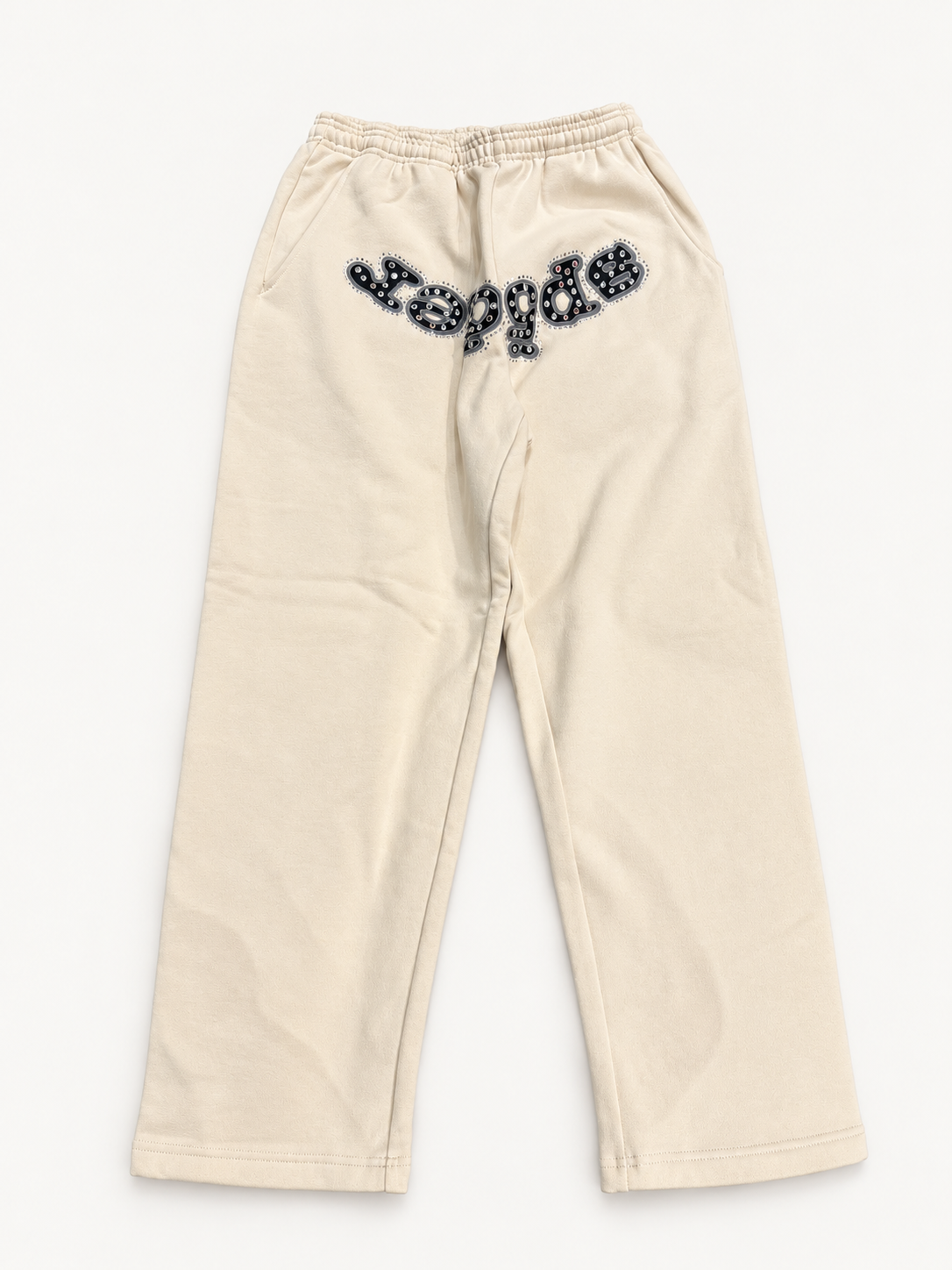 Sp5der Cream Stone Sweatpants studio view.